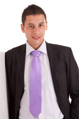 Business man leaning against wall