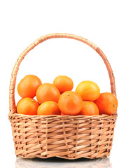 tangerines in a beautiful basket isolated on white