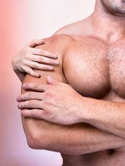 Woman's hands on a sexy man's torso