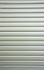 Obraz premium Wyblakła tekstura ocynkowanej i falistej blachy stalowej