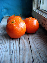 Fresh mandarins oranges on an old retro window sill