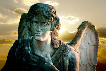 angel statue on sunset background