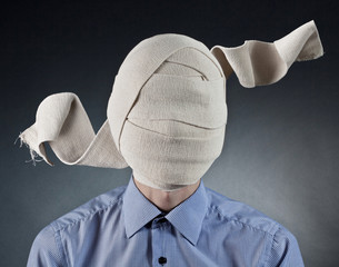 Portrait of the man with elastic bandage on a head