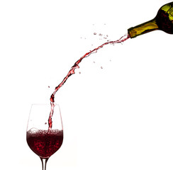 Wine pouring from bottle into glass © steheap