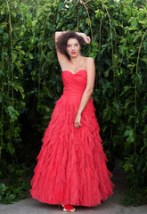 Obraz na płótnie Canvas Beautiful woman in red dress
