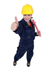 Thumbs up from a female construction worker