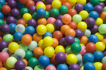 Fototapeta na wymiar Bed of Colorful Plastic Balls