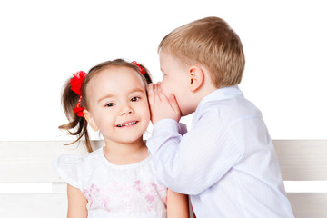 Girl and boy  whispering