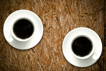 Coffee cup on grunge wood table