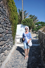 Greek woman on the streets of Oia, Santorini, Greece