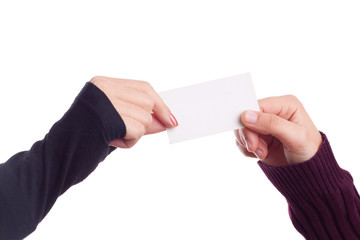 Two ladies hands holding a business card