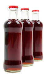 three glass bottles with cola