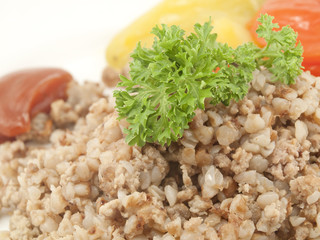 Buckwheat cereal decorated with parsley leaves