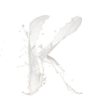 Letter K made of milk splash,isolated on white background