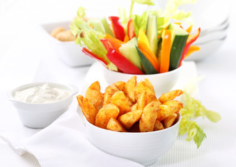 Raw vegetable and wedges with dip
