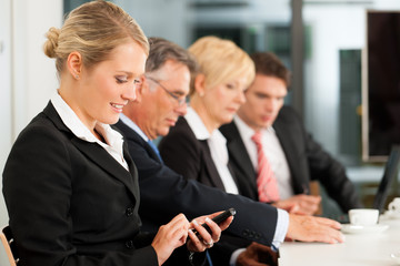 Business - team in office checking mails