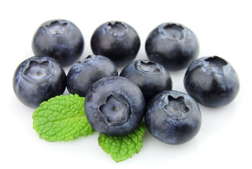 Ripe blueberry with mint closeup