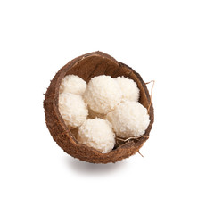white chocolate truffles in a box of coconut halves isolated on