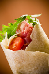 Tortillas with bacon and arugula salad