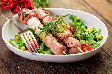 Meat Skewers on wooden table