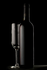 Bottle of wine and empty glass