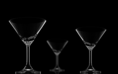 One Sharp and Two Blur Cocktail glasses on black background and