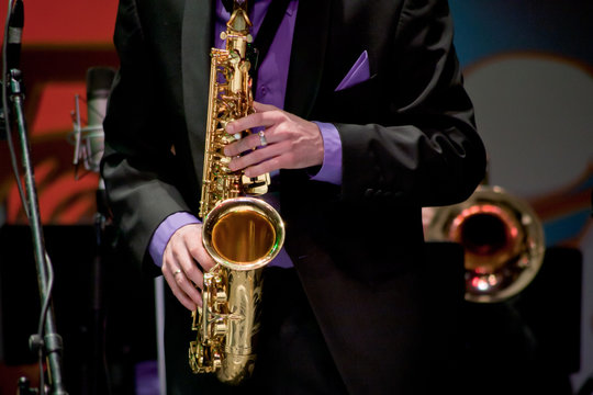 saxophonist plays on saxophone