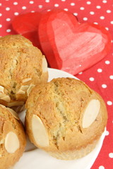 almond muffins with red hearts - obrazy, fototapety, plakaty