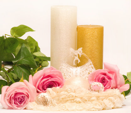 Romantic still-life with white candle and roses