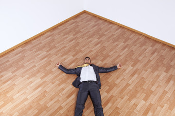 Businessman fainted on the office floor