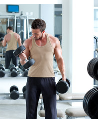 Fototapeta na wymiar man with weight training equipment on sport gym