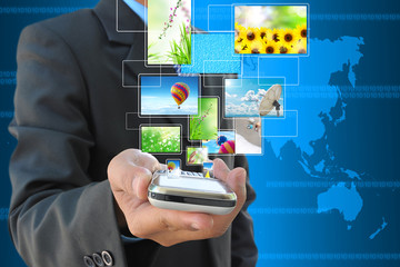 businessman hand holding mobile phone and streaming images