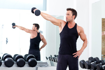 Fototapeta na wymiar man with weight training equipment on sport gym