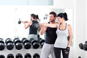 gym woman personal trainer with weight training