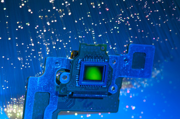 CCD sensor on a card of digital camera with fiber optical background