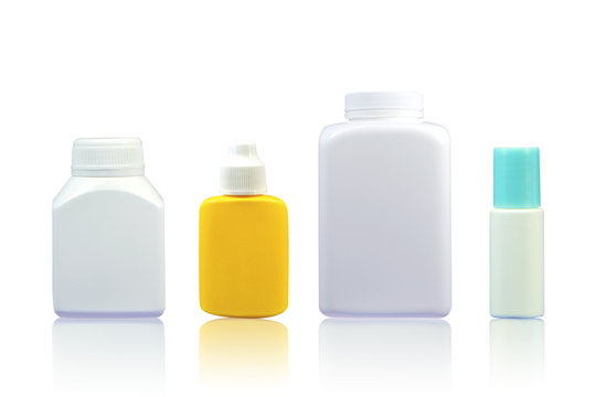Set of medical plastic bottles on white background