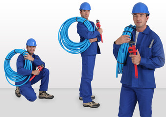 blue collar with hard hat carrying hose on his shoulder