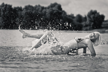 Young attractive woman in the water