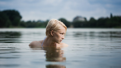 Young attractive woman in the water