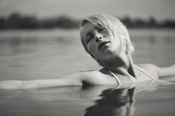 Fototapeta premium Young attractive woman in the water