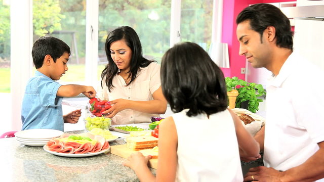 Young Asian Family Making Healthy Lunch