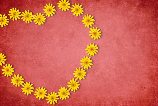 Heart made of flowers on red background
