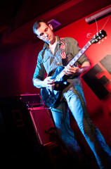 Obraz premium musician plays a guitar