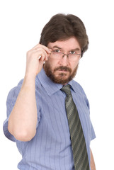 Portrait of a serious young man in glasses