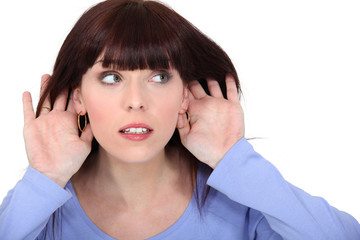 Woman making listening gesture