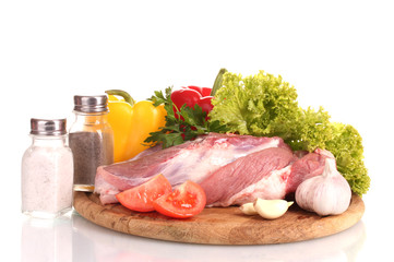 Raw meat and vegetables on a wooden board isolated on whitе