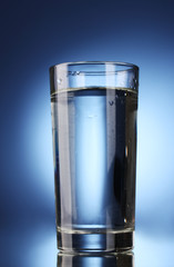 glass of water on blue background