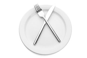 White empty plate with fork and knife isolated on white