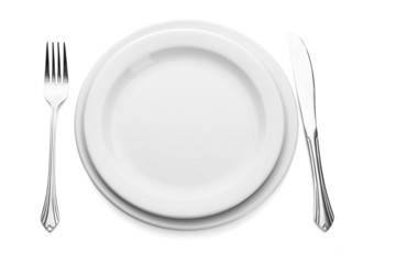 White empty plate with fork and knife isolated on white