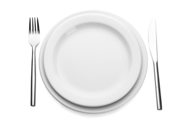White empty plate with fork and knife isolated on white